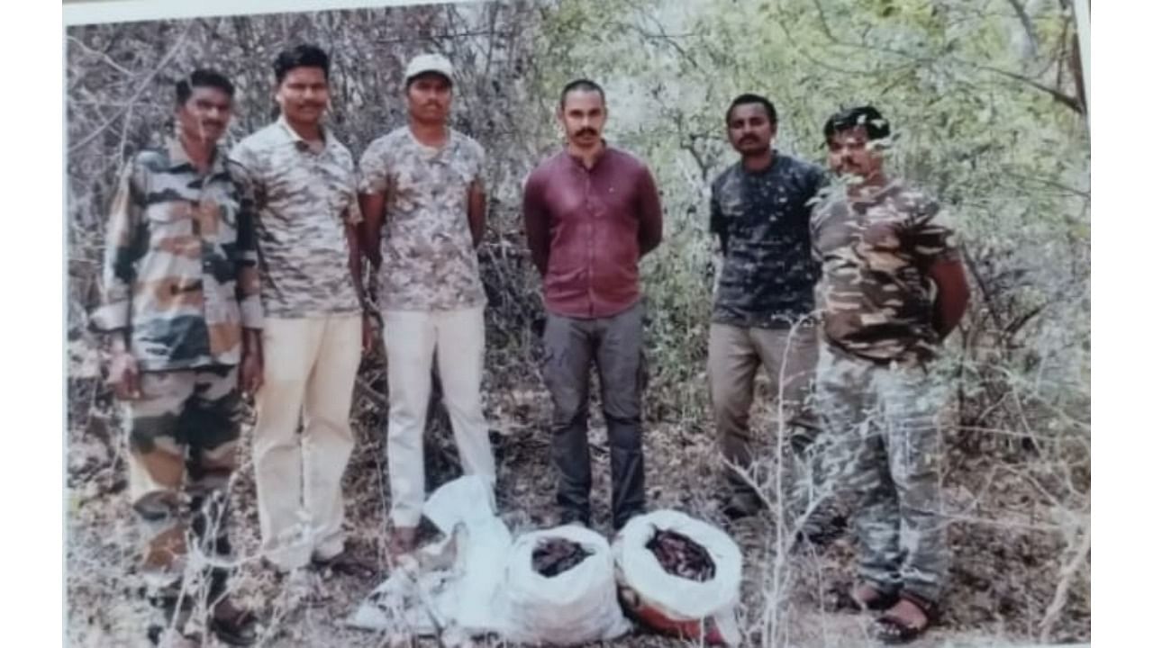 Karnataka Forest department personnel seen with the abandoned meat, at Cauvery Wildlife Sanctuary. Credit: Special Arrangement