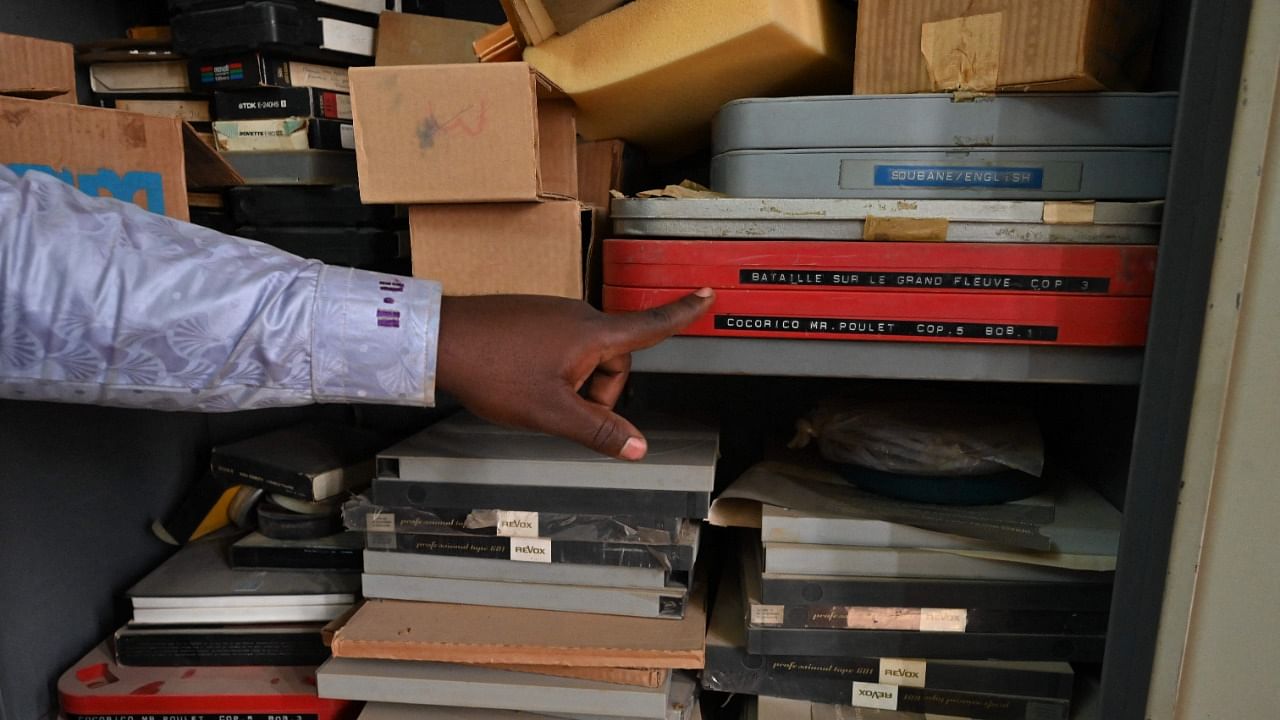 A man shows archives in the late French ethnographer and filmmaker Jean Rouch's editing room at the Institute for Research in Human Sciences (IRSH) in Niamey. Credit: AFP Photo
