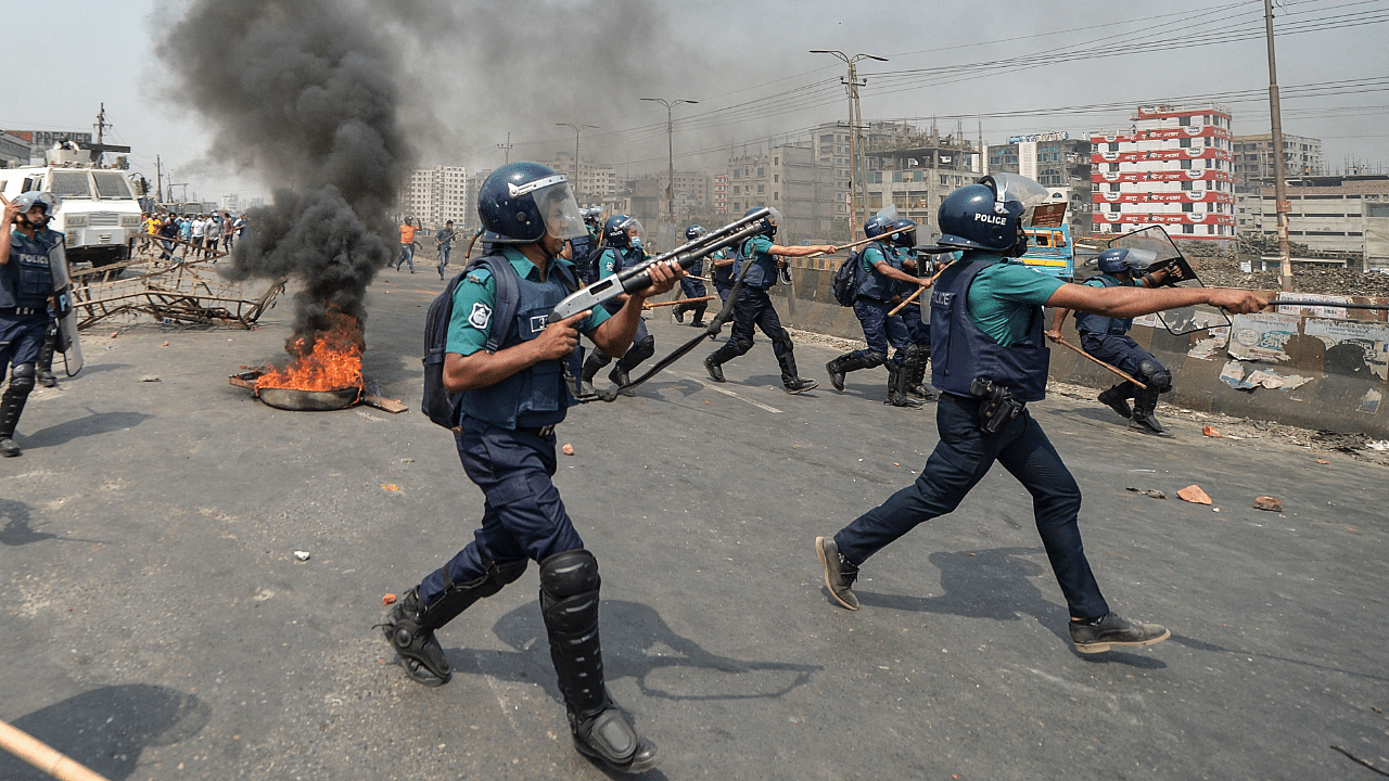 Police personnel march towards activists from Hefazat-e Islam as they block a road during a nationwide strike following deadly clashes with police over Indian Prime Minister Narendra Modi’s visit. Credit: AFP Photo