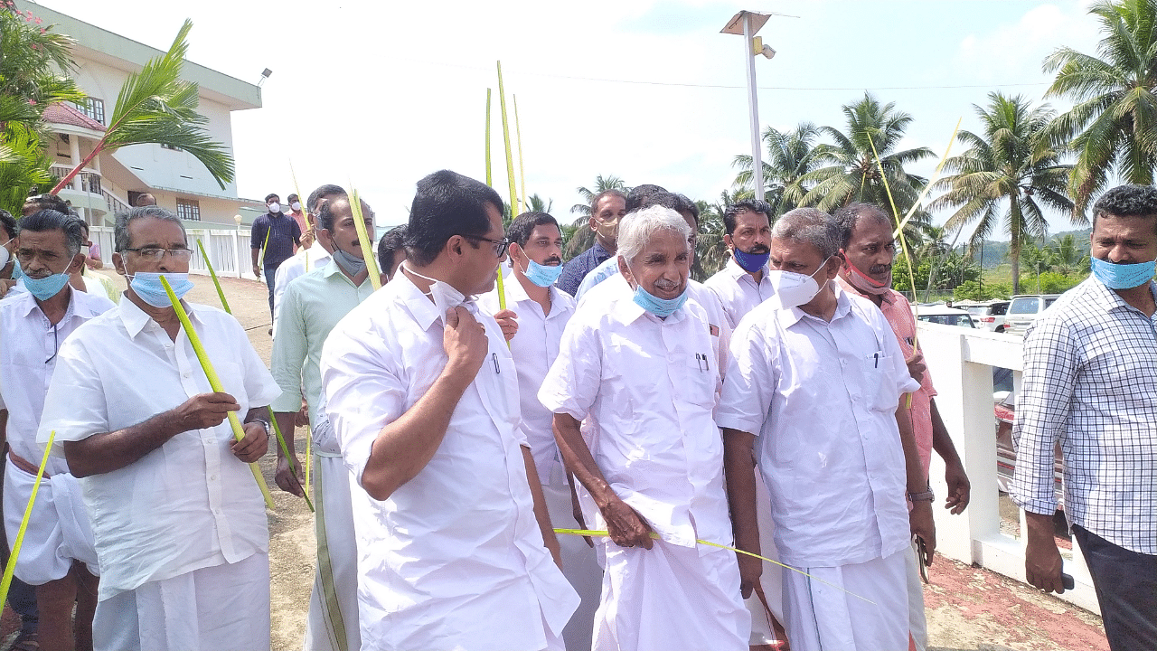 Oommen Chandy coming out of the Puthuppally Church after Palm Sunday mass. Credit: DH Photo