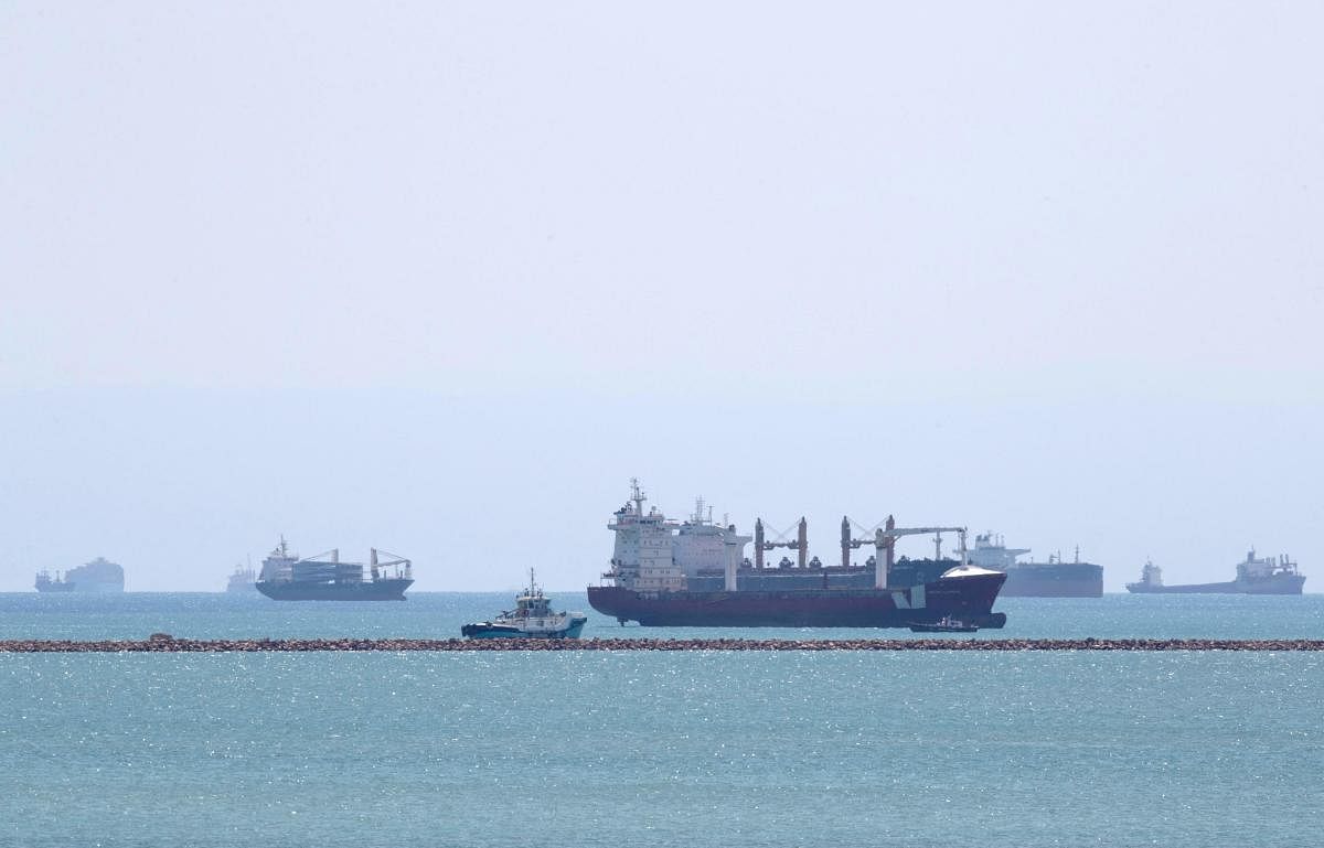 Gibraltar-flagged container ship Indian Express (C) along other ships near the entrance of the Suez Canal, by Egypt's Red Sea port city of Suez. Credit: AFP Photo