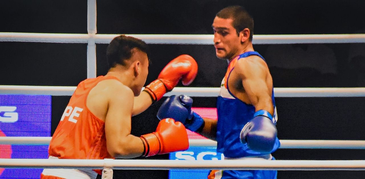 Kumar's (Right) boxing journey began when he was in school. Credit: PTI Photo