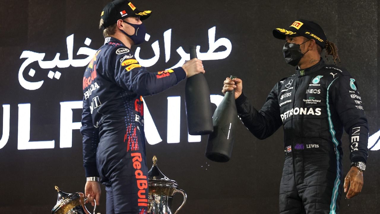Red Bull's Max Verstappen and Mercedes' Lewis Hamilton on the podium after the Bahrain Grand Prix. Credit: AFP 