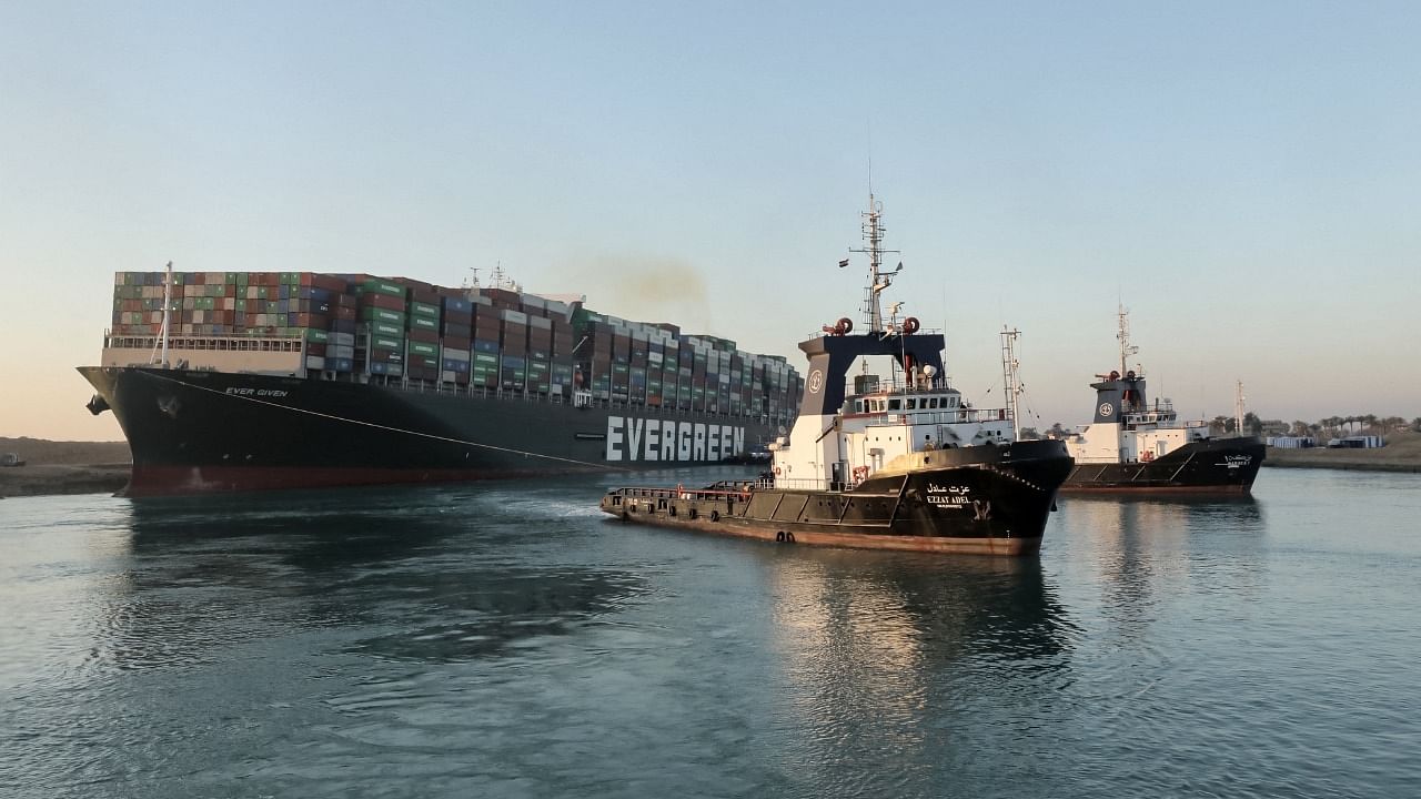 Tugboats pull the Panama-flagged MV 'Ever Given' (operated by Taiwan-based Evergreen Marine) container ship. Credit: AFP Photo
