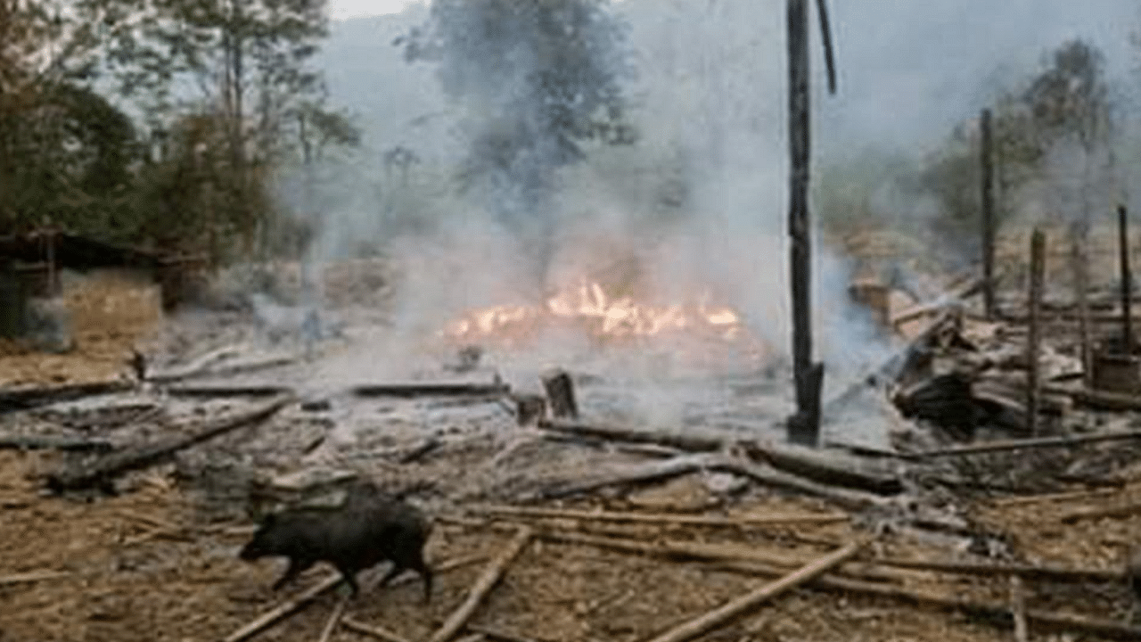 This handout from the Karen Information Center taken and released to AFP on March 29, 2021 shows burning ruins in Day Bu No village in eastern Myanmar's Karen state, following an air strike after the Karen National Union (KNU), a Karen ethnic armed group, seized a military base. Credit: AFP