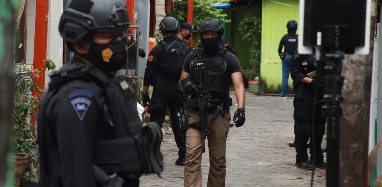 Indonesian police from an anti-terror unit conduct a raid at a house where the two attackers lived in Makassar on March 29, 2021, one day after a suicide bombing at a cathedral on Palm Sunday. Credit: AFP Photo