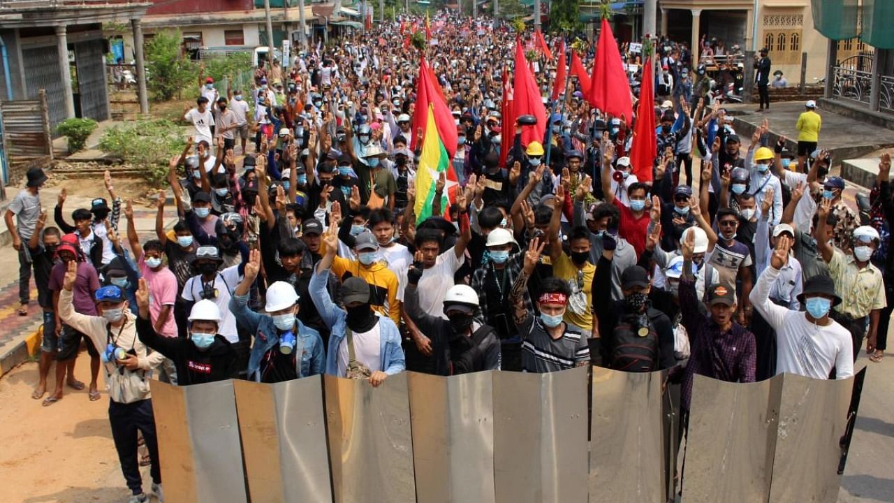This handout photo taken and released by Dawei Watch on March 27, 2021 shows protesters taking part in a demonstration against the military coup in Dawei. Credit: Handout / DAWEI WATCH / AFP