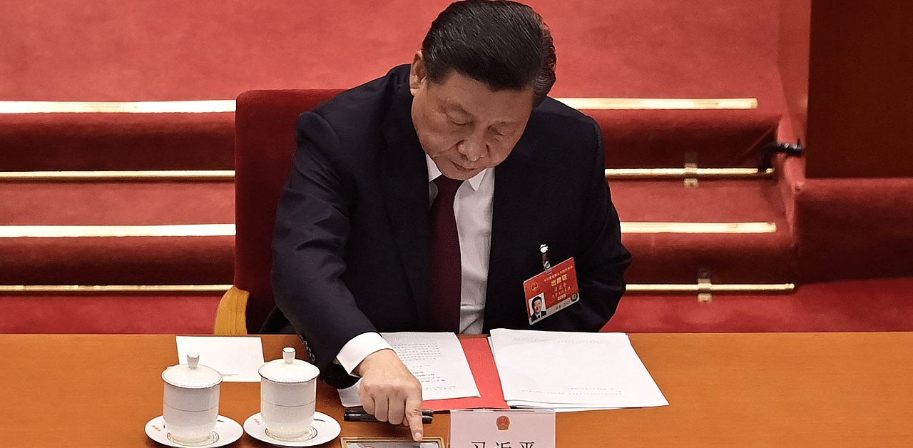China's President Xi Jinping votes on changes to Hong Kong's election system during the closing session of the National People's Congress at the Great Hall of the People in Beijing. Credit: AFP Photo