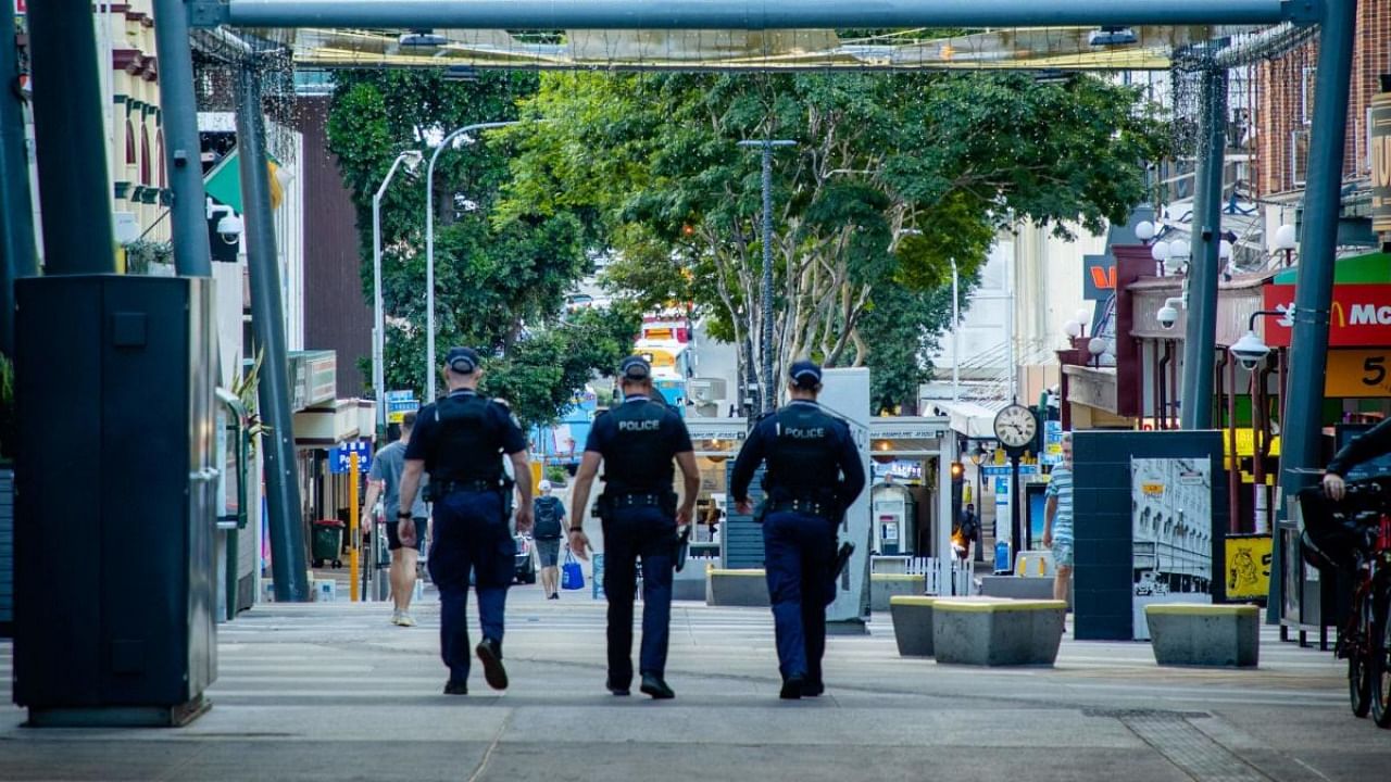 Police officers patrol the Valley Mall in Brisbane on March 29, 2021 as more than two million people in the city entered a three-day lockdown after a cluster of coronavirus cases was detected in Australia's third-biggest city. Credit: AFP file photo.