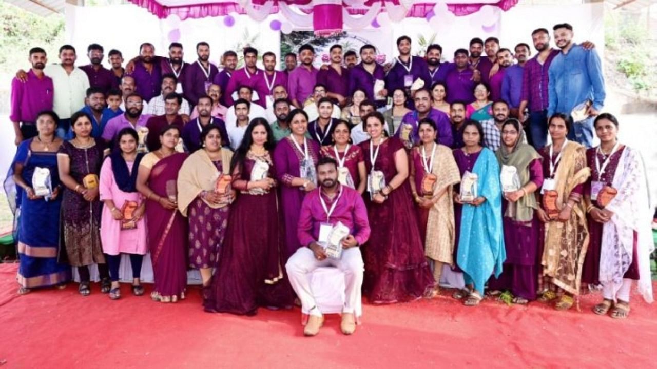 The 2001 batch students of Government High School, Palibetta, with their teachers,during the student reunion held recently. Credit: DH Photo