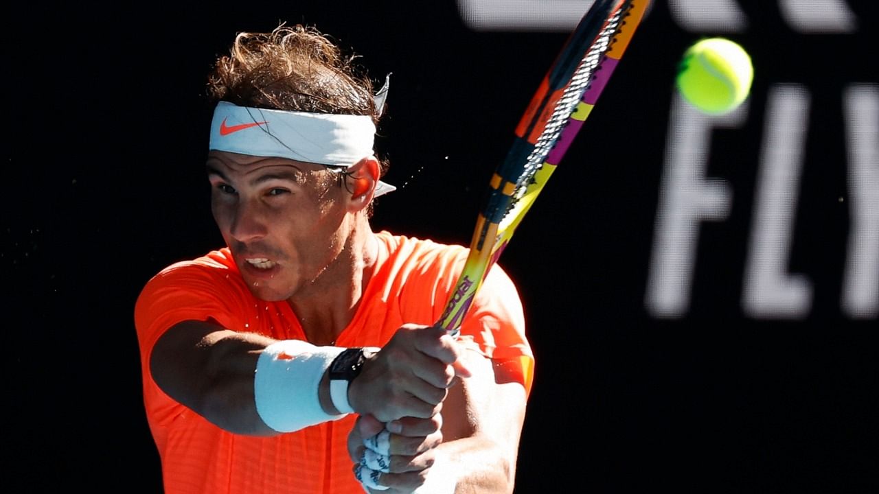 Spain's Rafael Nadal makes a backhand return to Serbia's Laslo Djere during their first round match at the Australian Open tennis championship in Melbourne, Australia. Credit: AP/PTI Photo.