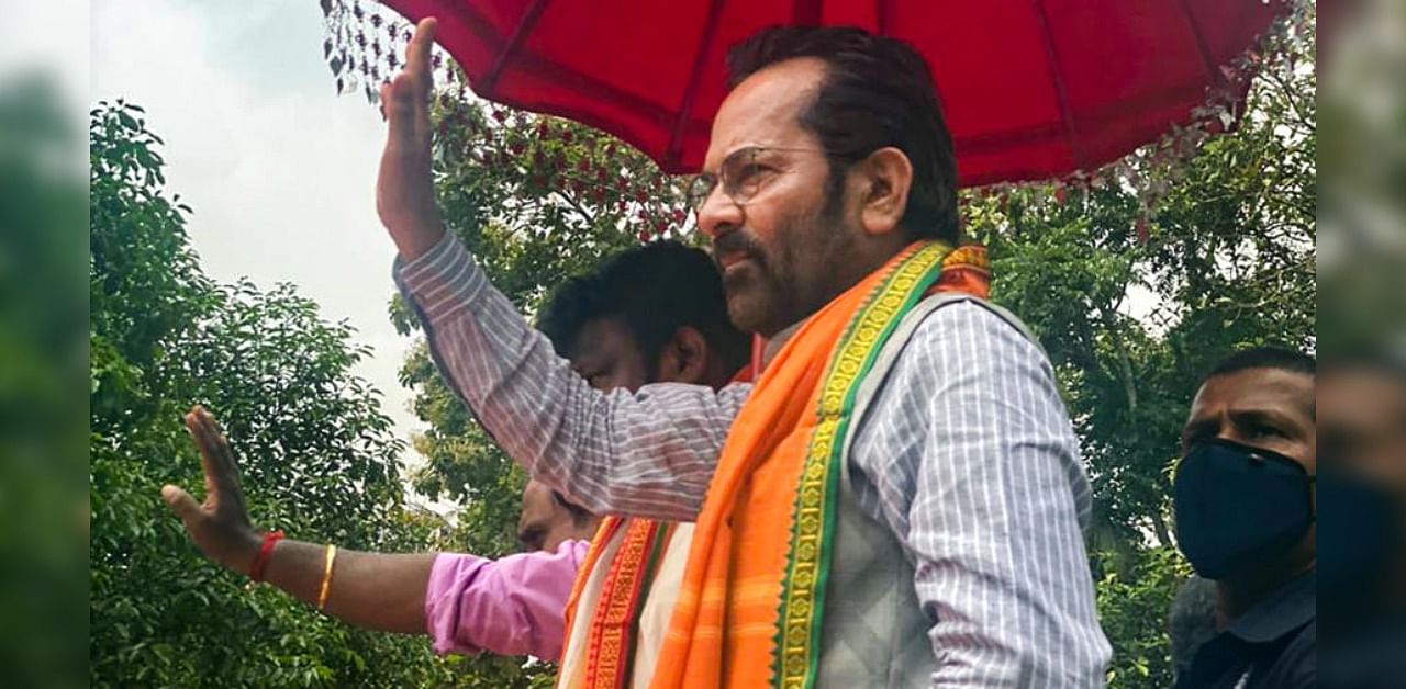 Senior BJP leader and Union Minority Affairs Minister Mukhtar Abbas Naqvi addresses a public meeting during in roadshow in support of party candidates, in Piravam. Credit: PTI Photo