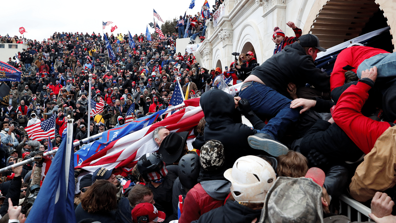 Pro-Trump protesters storm into the U.S. Capitol during clashes with police, during a rally to contest the certification of the 2020 US presidential election results by the US Congress. Credit: Reuters Photo