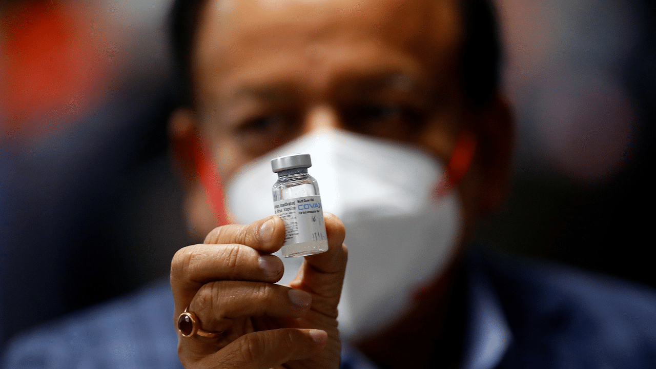 Indian Health Minister Harsh Vardhan holds a dose of Bharat Biotech's COVID-19 vaccine called COVAXIN, during a vaccination campaign at All India Institute of Medical Sciences (AIIMS) hospital in New Delhi. Credit: Reuters File Photo