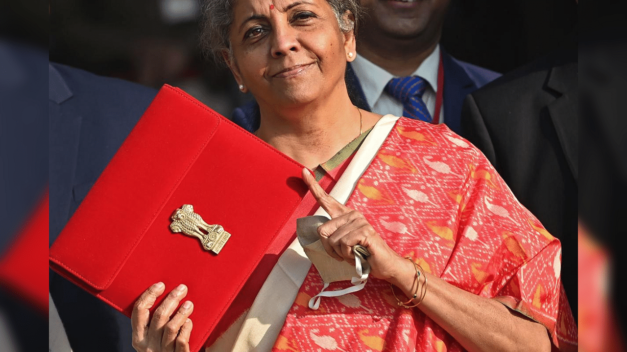 India's Finance Minister Nirmala Sitharaman gestures as she leaves the Finance Ministry to present the annual budget in parliament in New Delhi on February 1, 2021. Credit: AFP Photo
