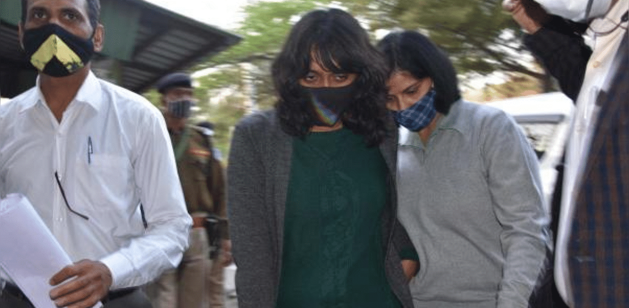 Disha Ravi (C) is escorted after being granted bail. Credit: AFP Photo