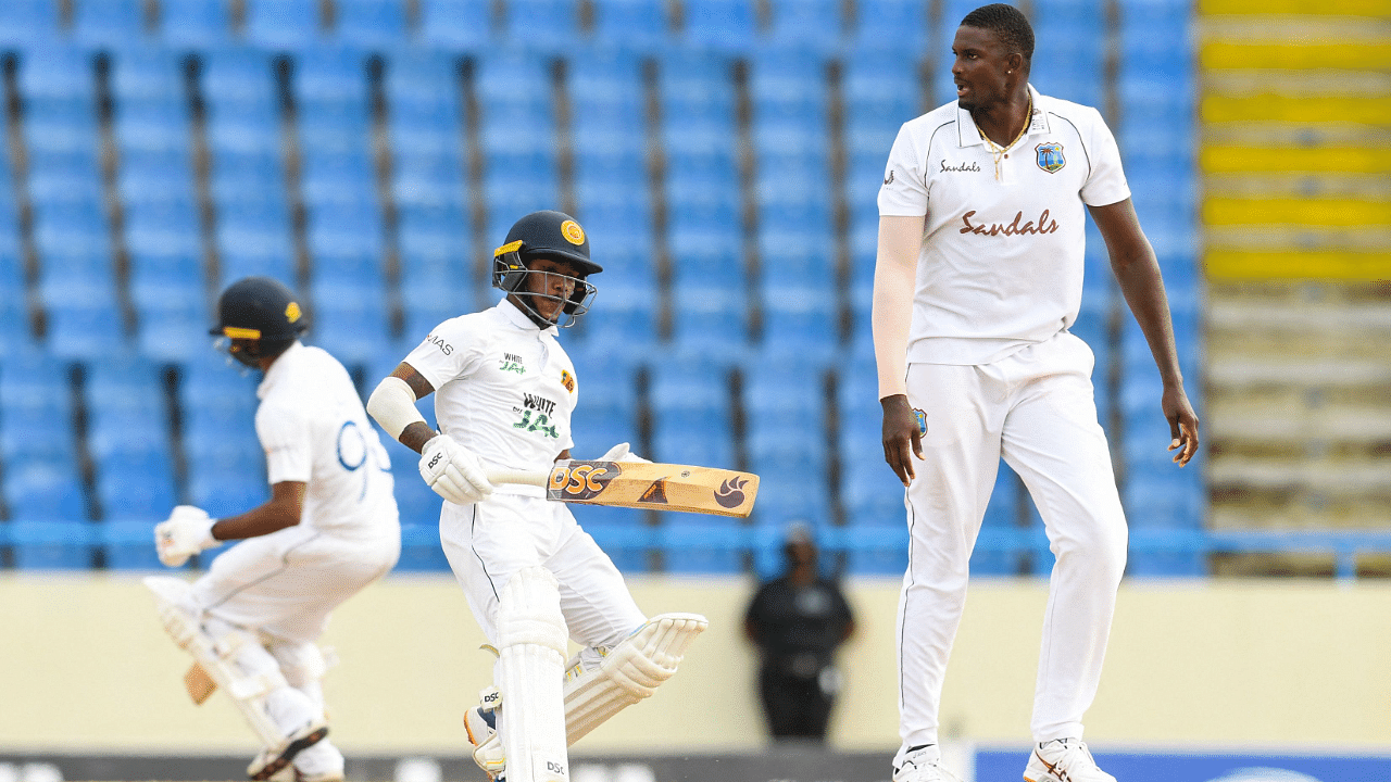 Pathum Nissanka (L) of Sri Lanka get runs off Jason Holder (R) of West Indies during day 3 of the 2nd Test between West Indies and Sri Lanka at Vivian Richards Cricket Stadium in North Sound, Antigua and Barbuda. Credit: AFP Photo
