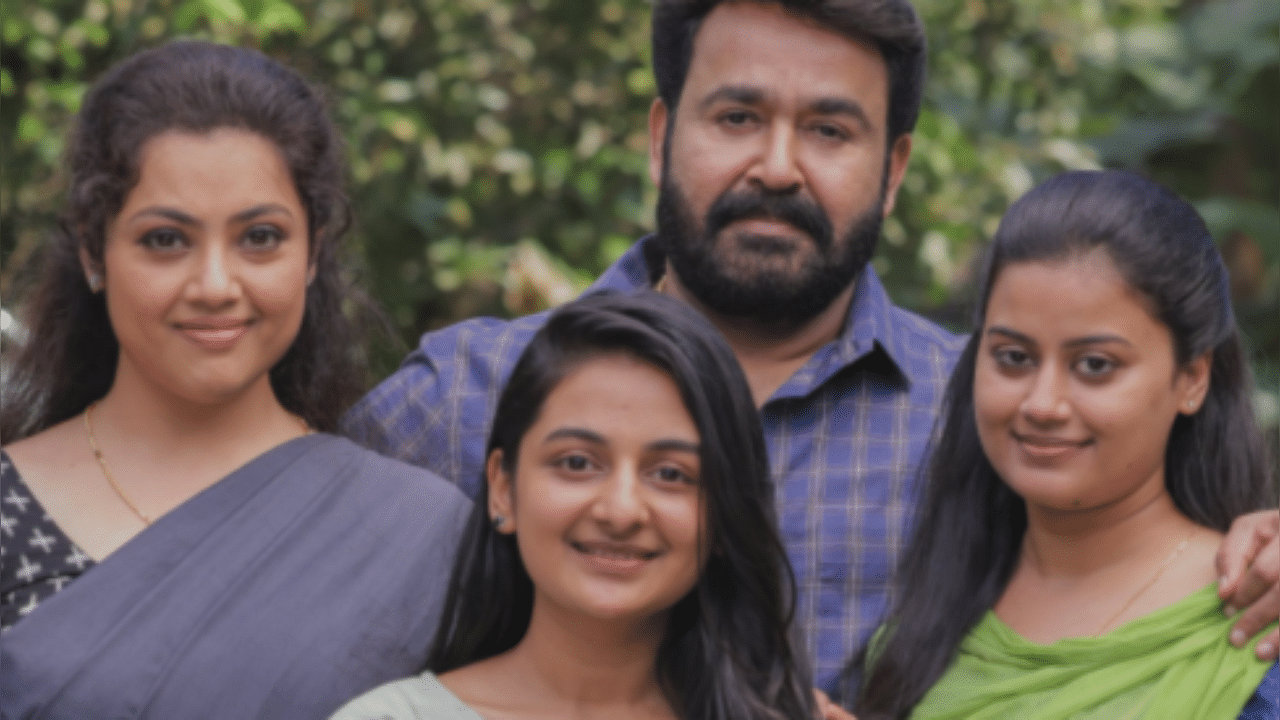 Actor Meena with her 'Drishyam family'. Credit:Twitter/@Mohanlal