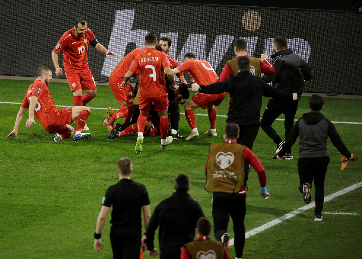  North Macedonia's Eljif Elmas celebrates scoring their second goal with teammates. Credit: Reuters photo. 