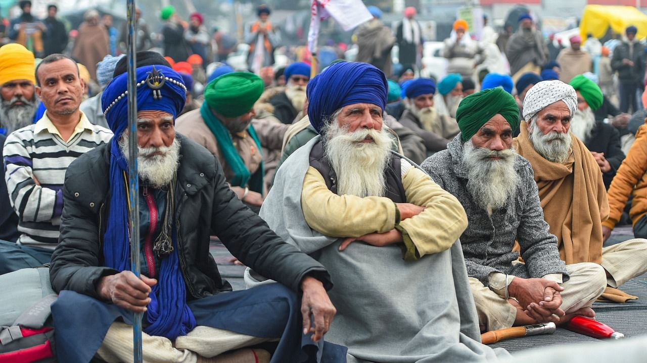 Farmers during the ongoing protest against the new farm laws, at Singhu Border. Credit: PTI Photo