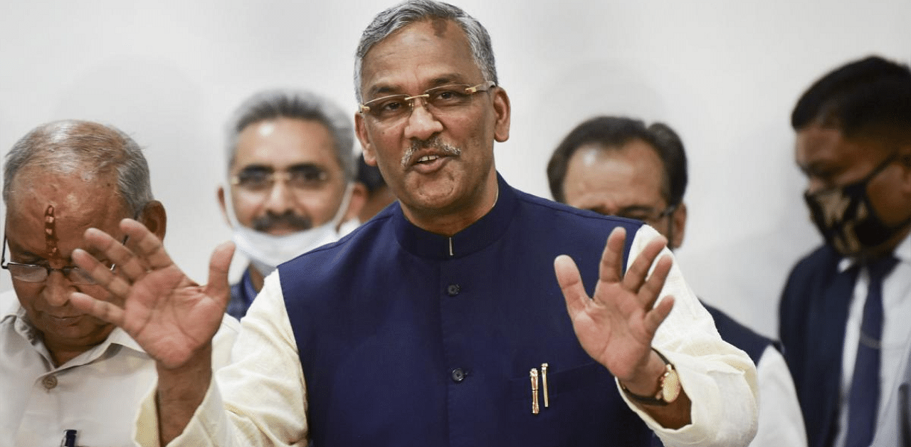 Uttarakhand Chief Minister Trivendra Singh Rawat addresses a press conference after tendering his resignation formally to Governor Baby Rani Maurya, in Dehradun. Credit: PTI photo. 