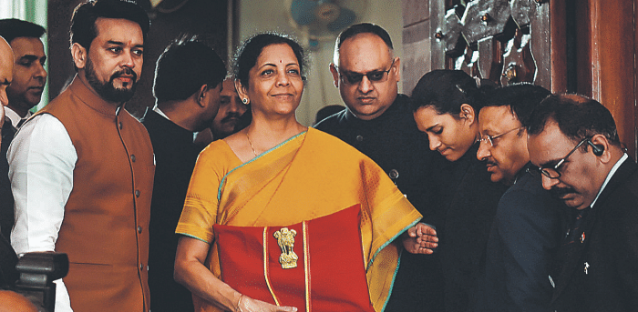Union Finance Minister Nirmala Sitharaman, flanked by her deputy Anurag Thakur, shows a folder containing the Union Budget documents. Credit: PTI File Photo