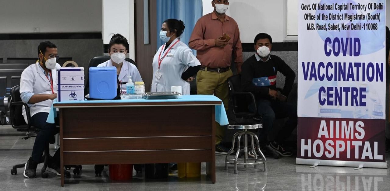 Health workers wait for the start of the Covid-19 coronavirus vaccination drive at the All India Institute of Medical Science (AIIMS) in New Delhi in January 16, 2021. Credit: AFP Photo