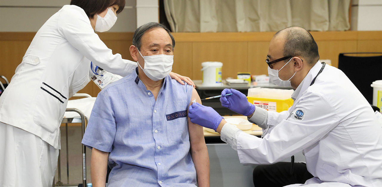 Japan's Prime Minister Yoshihide Suga receives his first dose of the Pfizer-BioNtech Covid-19 vaccine. Credit: Reuters Photo
