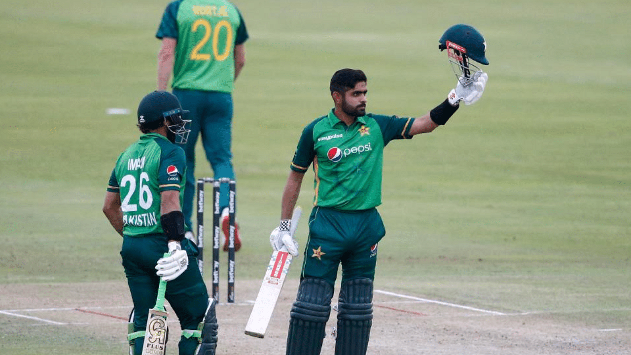 Pakistan's captain Babar Azam (R) celebrates after scoring a century (100 runs) during the first one-day international (ODI) cricket match between South Africa and Pakistan at SuperSport Park in Centurion on April 2, 2021. Credit: AFP Photo