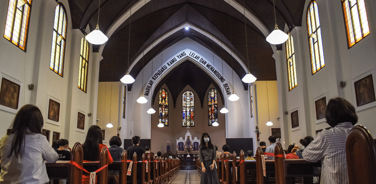 Catholics attend church on Good Friday in Bandung, West Java province. Credit: AFP Photo