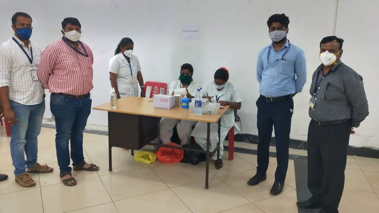 Dharwad Health Department officials making preparations at Hubballi Airport to inoculate the front-line workers on Friday. Credit: Hubballi Airport Director Pramod Kumar Thakre.