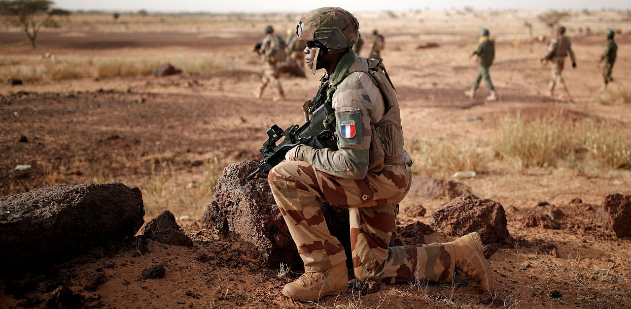 Troops from the Malian Armed Forces and French soldiers conduct a joint patrol during the regional anti-insurgent Operation Barkhane in Inaloglog, Mali. Credit: Reuters Photo