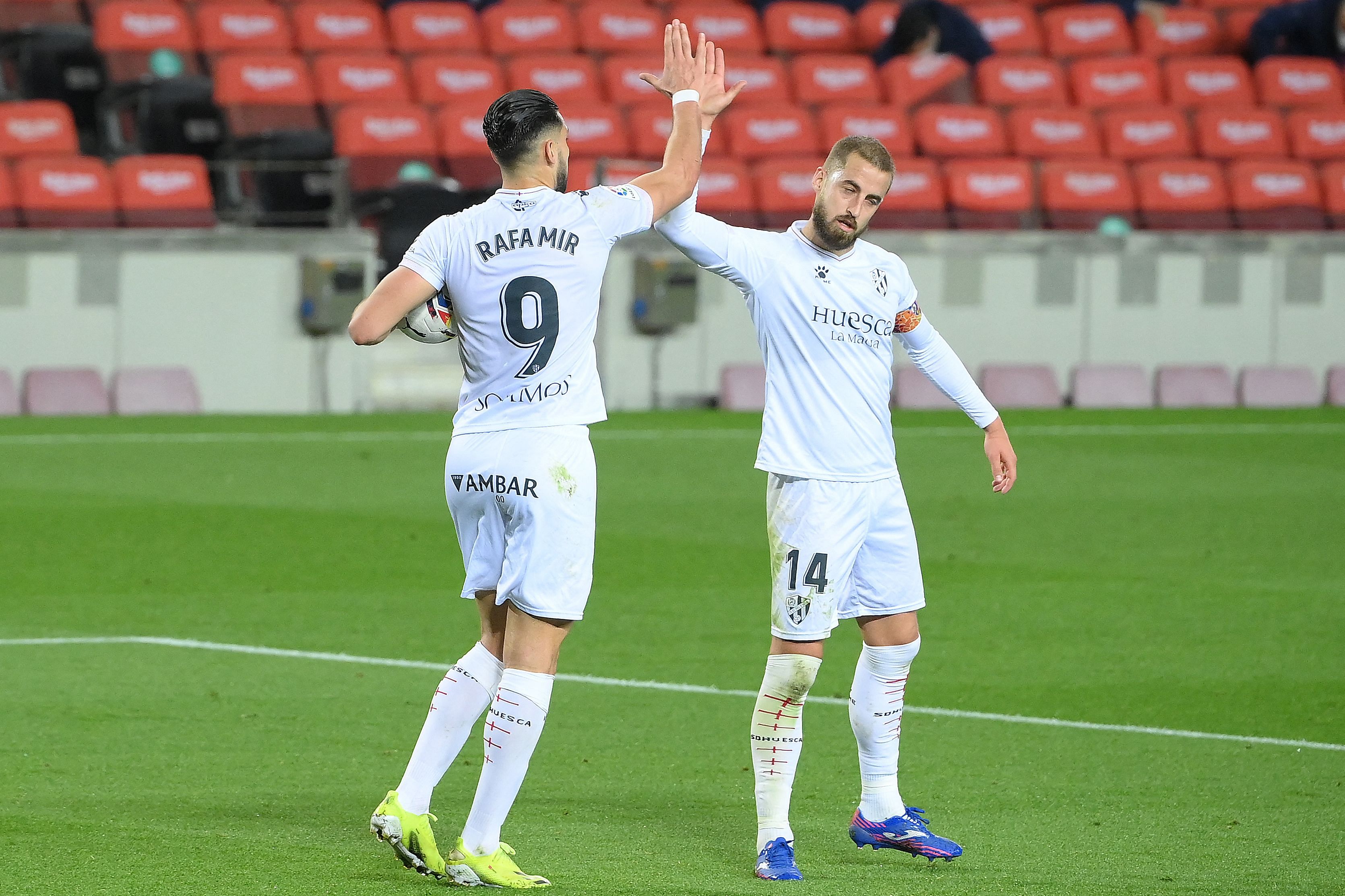 Huesca's Spanish forward Rafa Mir (L) celebrates with Huesca's Spanish defender Jorge Pulido. Credit: AFP Photo