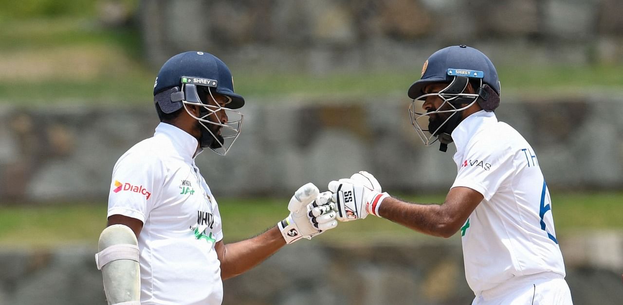 Karunaratne (L) made 75 and Thirimanne 39 in a 101-run opening stand. Credit: AFP Photo