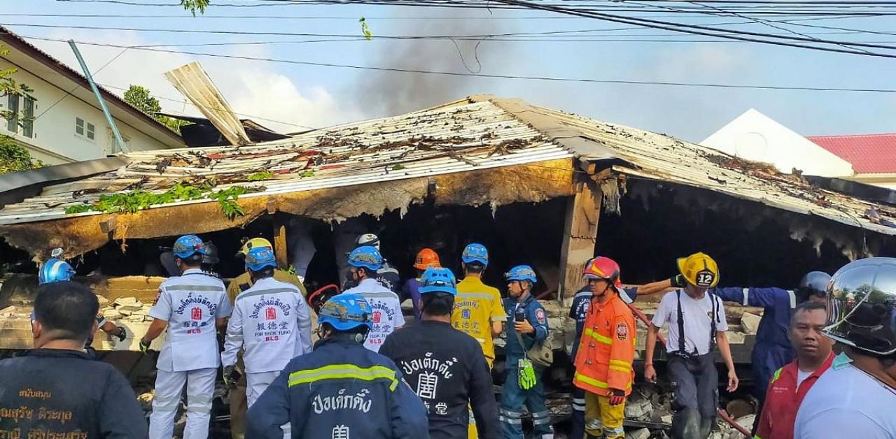 Rescue workers at the site of a building collapse in Bangkok. Credit: AFP Photo