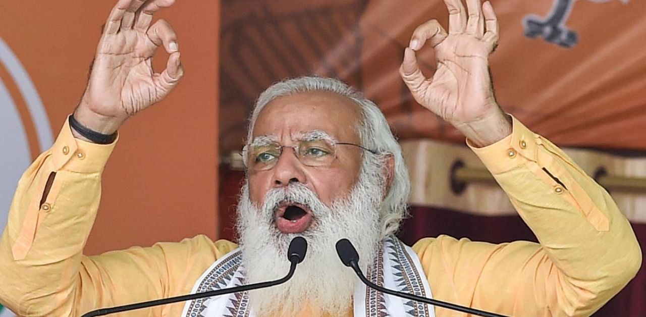  Prime Minister Narendra Modi addresses an election rally in support of BJP candidates ahead of the third phase of state Assembly polls, in Hooghly district. Credit: PTI Photo