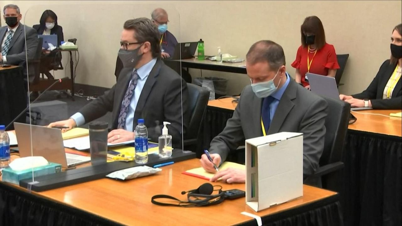 This screenshot obtained from pool video feed via Court TV on April 2, 2021, shows former police officer Derek Chauvin (R), charged in the death of George Floyd during his trial in Minneapolis, Minnesota. Credit: AFP/Pool via Court TV.