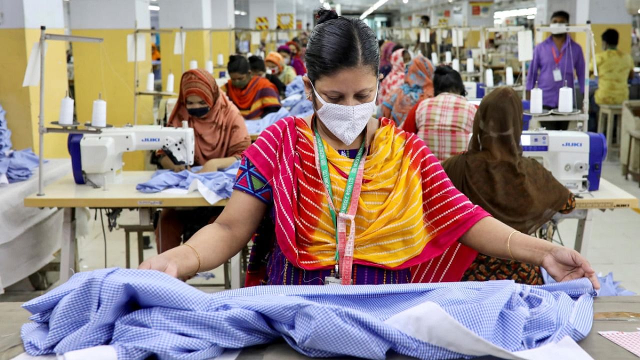 A woman works in a garment factory, as factories reopened after the government has eased the restrictions amid concerns over coronavirus disease outbreak in Dhaka. Credit: Reuters file photo.
