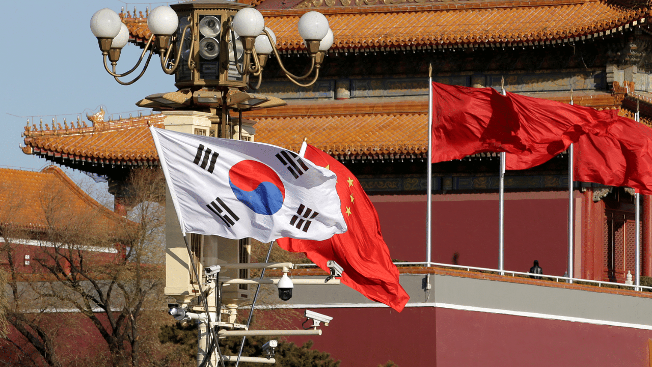 South Korea and China's flags flutter next to Tiananmen Gate in Beijing. Credit: Reuters Photo