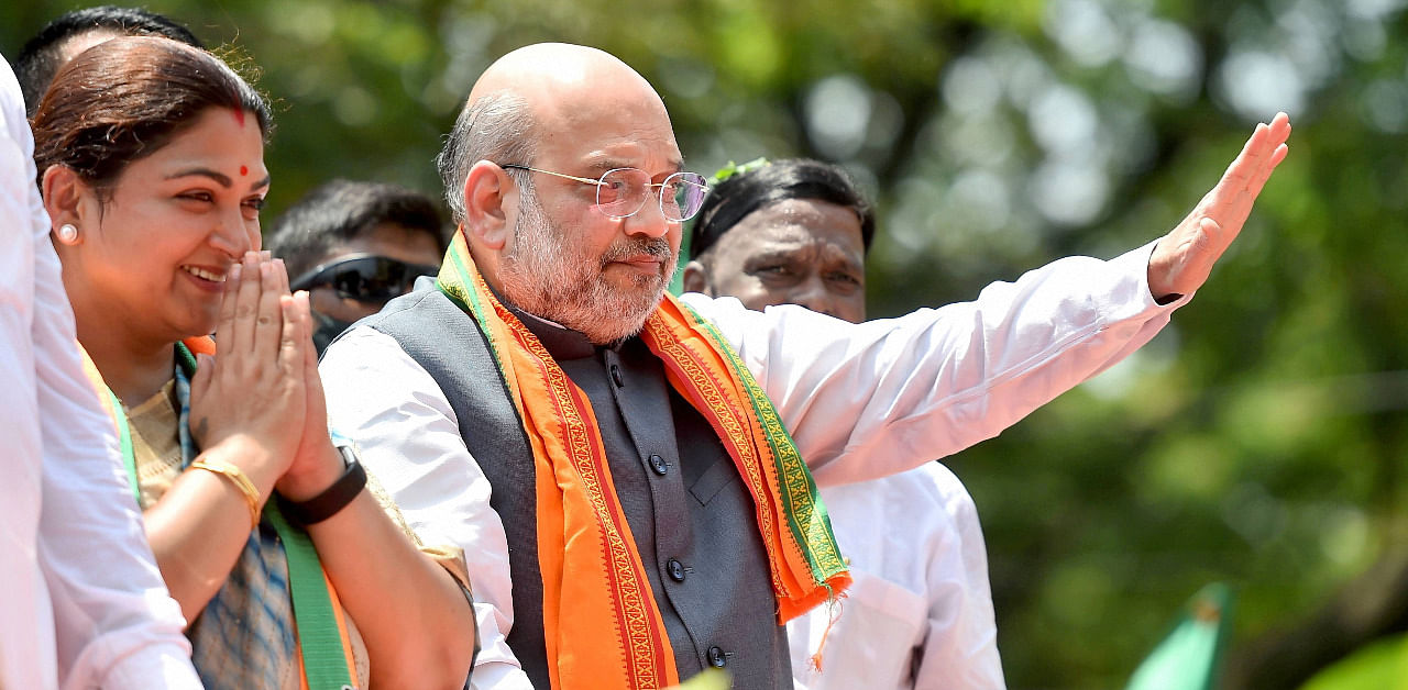 Union Home Minister Amit Shah during a roadshow in support of BJP candidate from Thousand Lights constituency Kushboo Sundar. Credit: PTI Photo