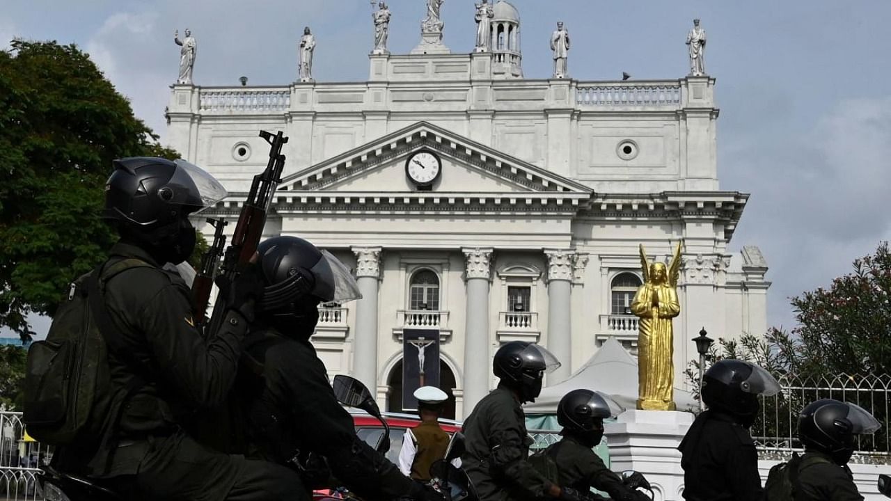 A Sri Lankan army motorcycle unit soldier patrols ahead of a Good Friday mass outside Saint Lucia's Church in Colombo. Credit: AFP.