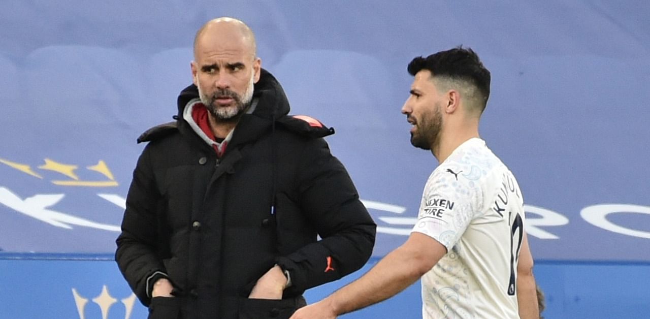 Aguero with Guardiola after being substituted off. Credit: Reuters Photo