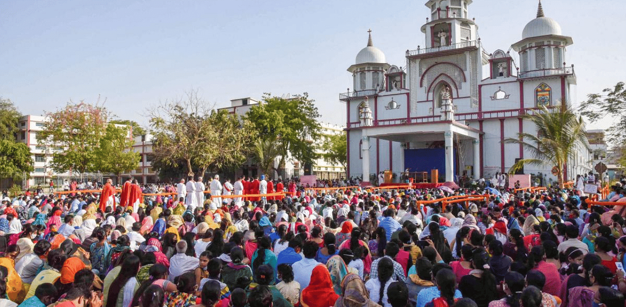 Devotees participate in a mass prayer on the occasion of Good Friday outside Kurji Church, amid the ongoing coronavirus pandemic, in Patna. Credit: PTI photo.