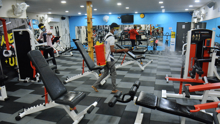 A worker sanitises a gym. Credit: PTI Photo