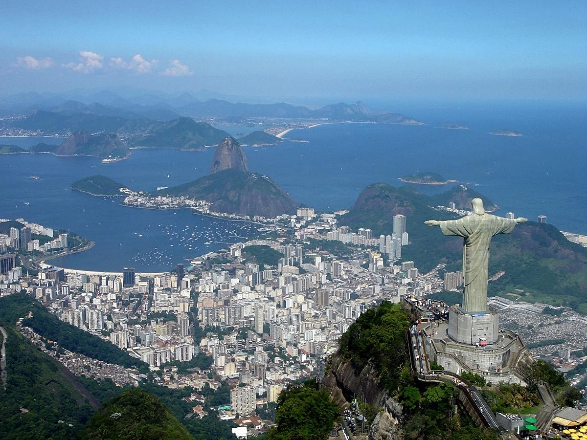 A panoramic view of the statue at the top of Corcovado Mountain with Sugarloaf Mountain (centre) and Guanabara Bay in the background. PHOTO COURTESY WIKIPEDIA