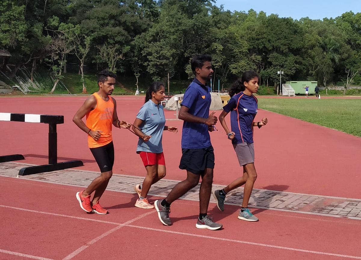 Rakshitha and Radha during a practice run with their guides. Credit: DH photo. 