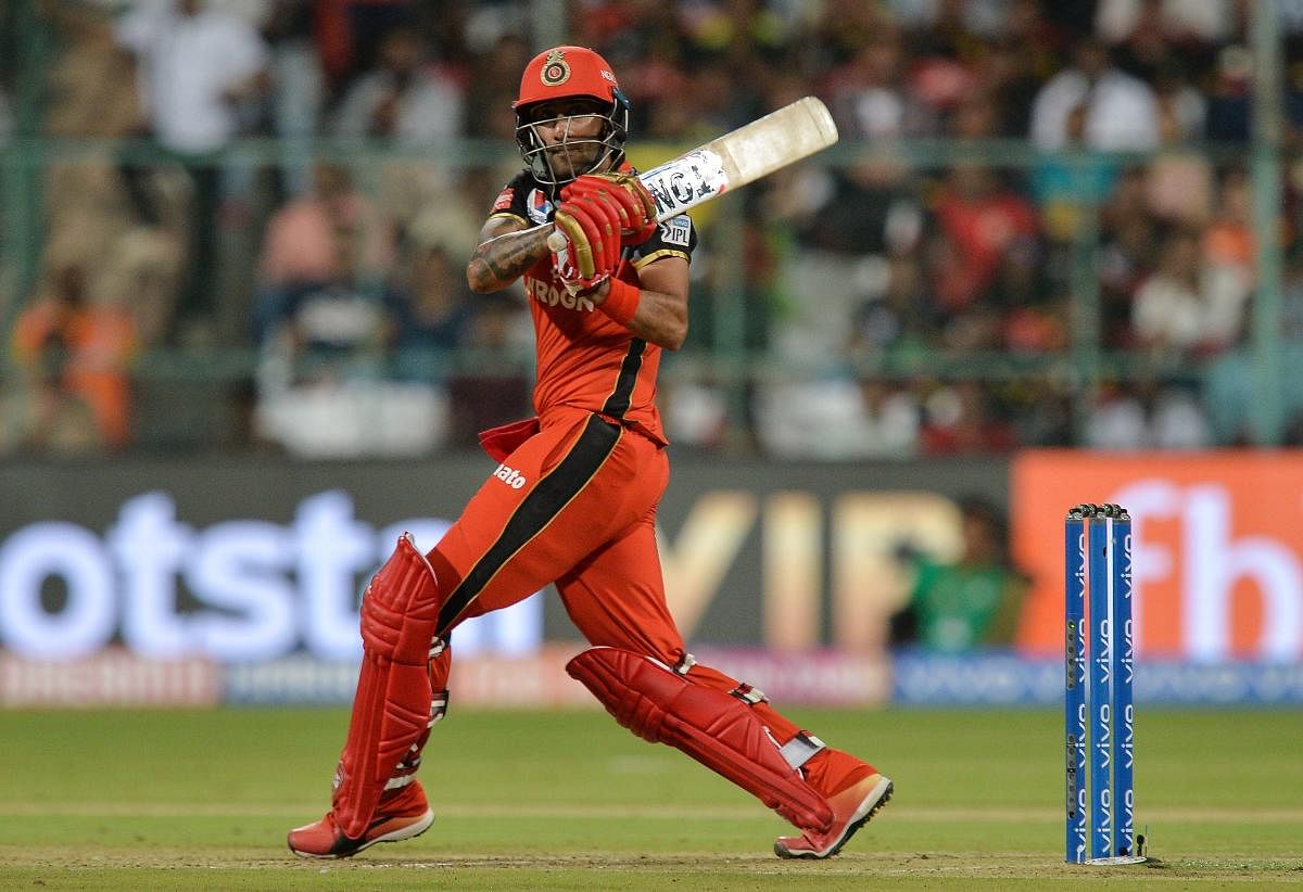 Gurkeerat Singh in action for RCB. Credit: AFP file photo.