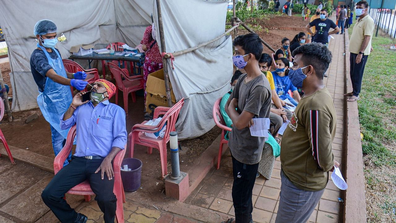 Citizens undergo Covid-19 test conducted by Thane Municipal Corporation, in Thane, Wednesday, March 24, 2021. Credit: PTI Photo
