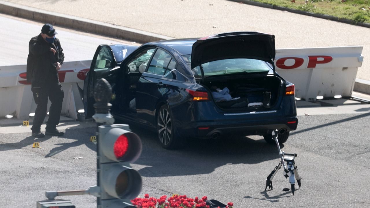Law enforcement investigate the scene after a vehicle charged a barricade at the US Capitol on April 02, 2021 in Washington, DC. Credit: AFP File Photo