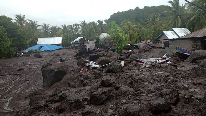 This handout photo taken on April 4, 2021 and released by the Indonesian National Board for Disaster Management (BNPB) shows the aftermath of a flash flood in the village of Lamanele on East Flores, where at least 23 people were killed and two missing after early morning flash floods. Credit: AFP Photo